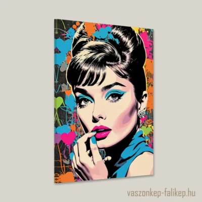 Ez a lenyűgöző vászonkép Audrey Hepburn ikonikus portréját ábrázolja Pop Art stílusban, amely élénk színekkel és merész vonalakkal emeli ki a színésznő időtlen eleganciáját és báját.